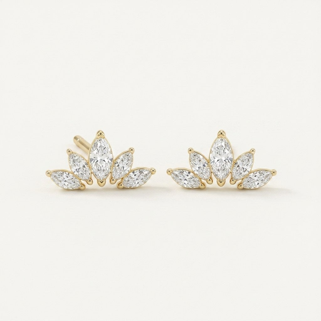 14K solid gold crystal lotus stud earrings on a warm ivory background