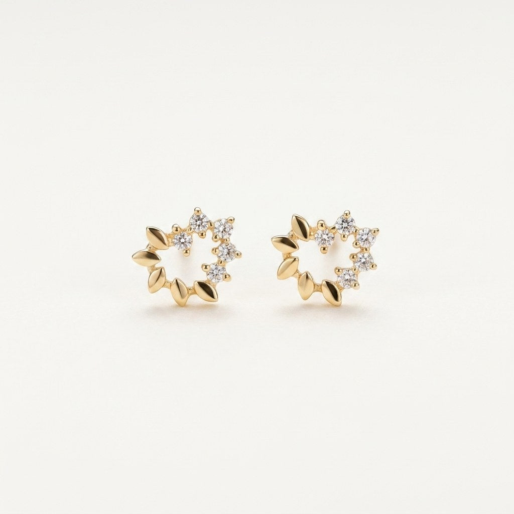 14K solid gold stone-set stud earrings on a warm ivory background