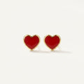 14K solid gold stud earrings on a warm ivory background