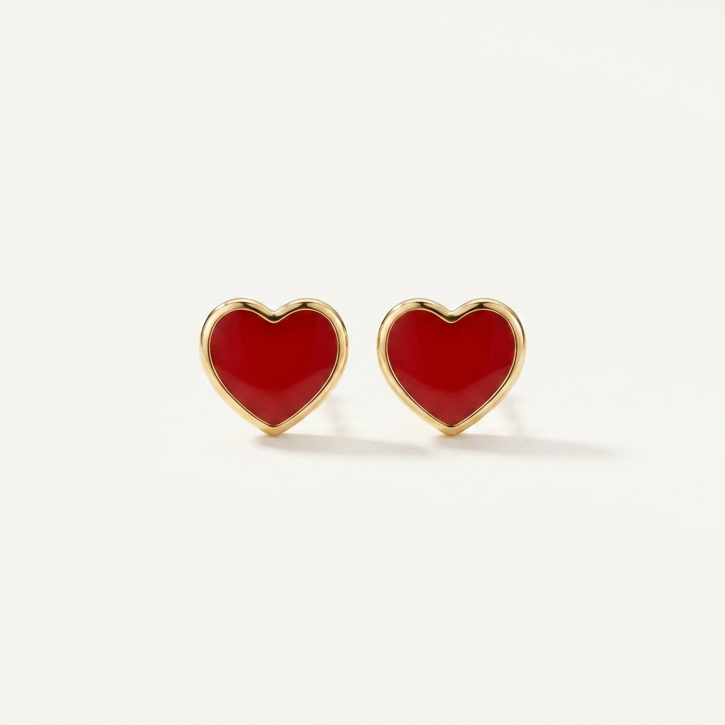 14K solid gold stud earrings on a warm ivory background