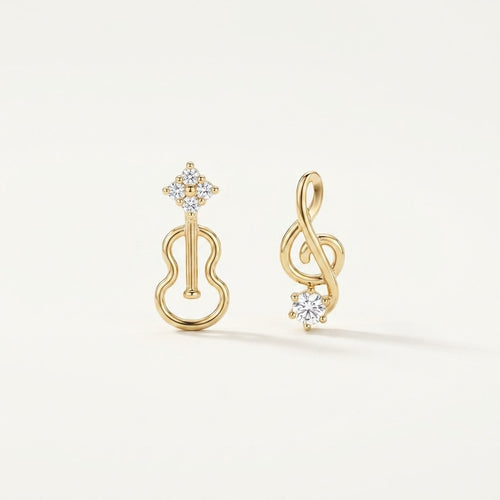 14K solid gold stone-set stud earrings on a warm ivory background
