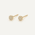 14K solid gold round crystal halo stud earrings on a warm ivory background