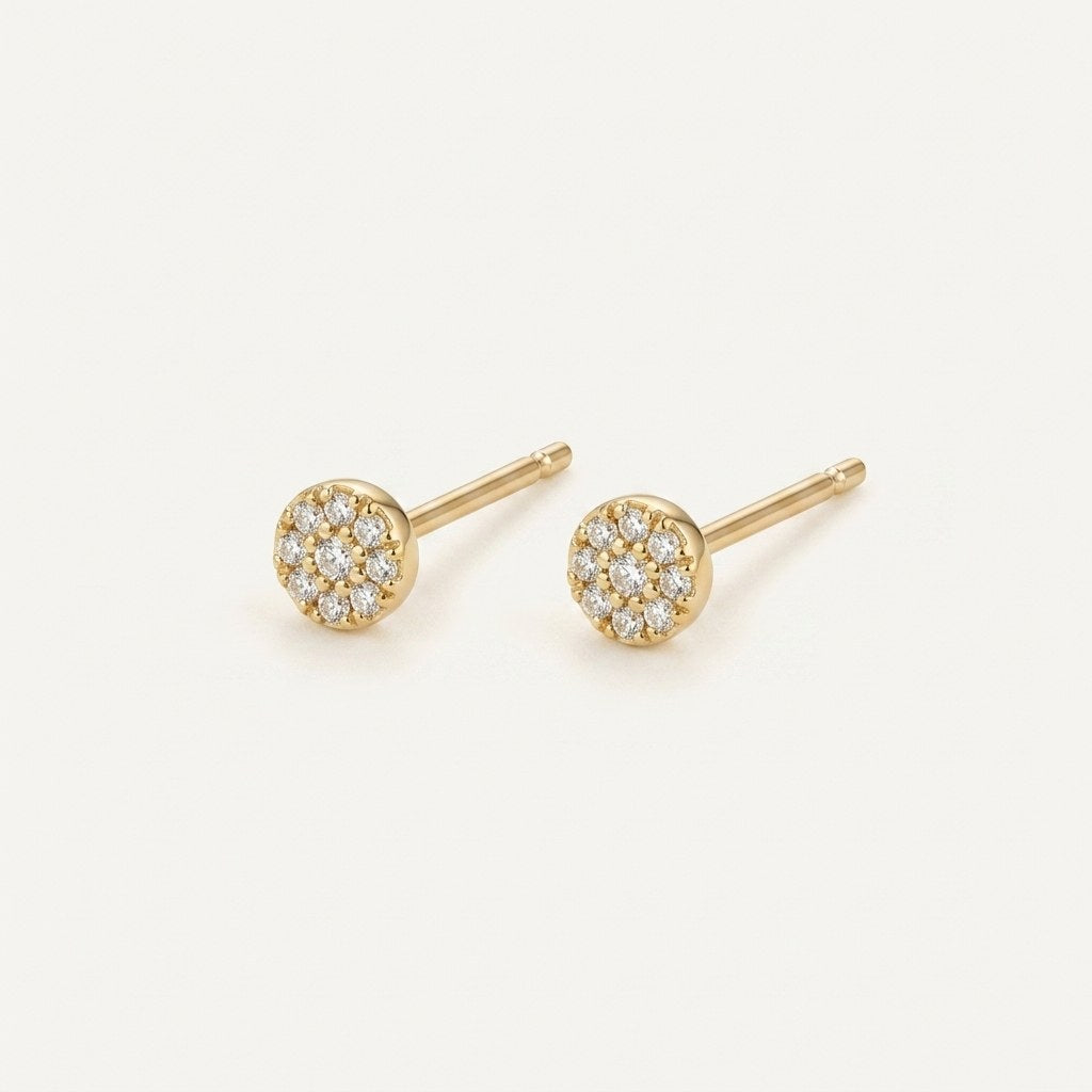 14K solid gold round crystal halo stud earrings on a warm ivory background