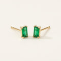 14K solid gold green emerald cut stud earrings on a warm ivory background