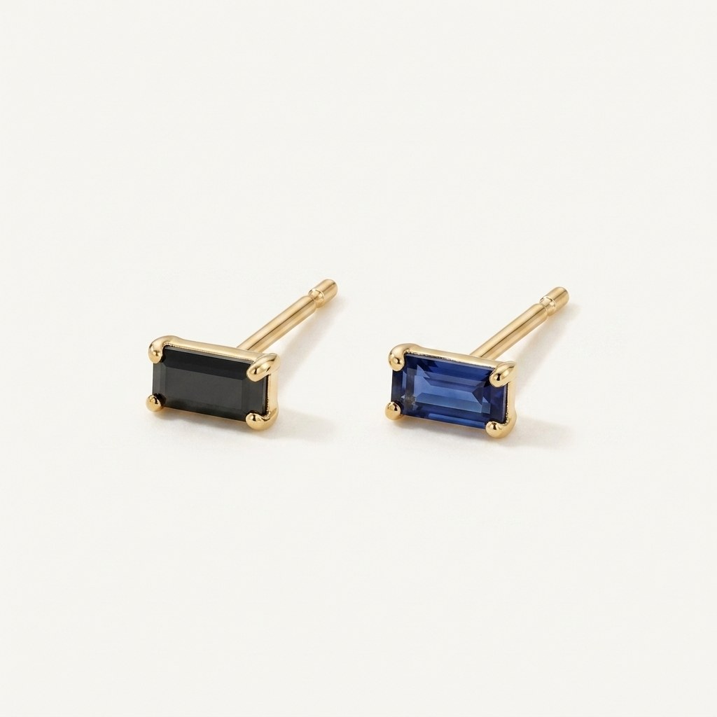 14K solid gold black emerald cut stud earrings on a warm ivory background