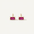 14K solid gold pink baguette stud earrings on a warm ivory background