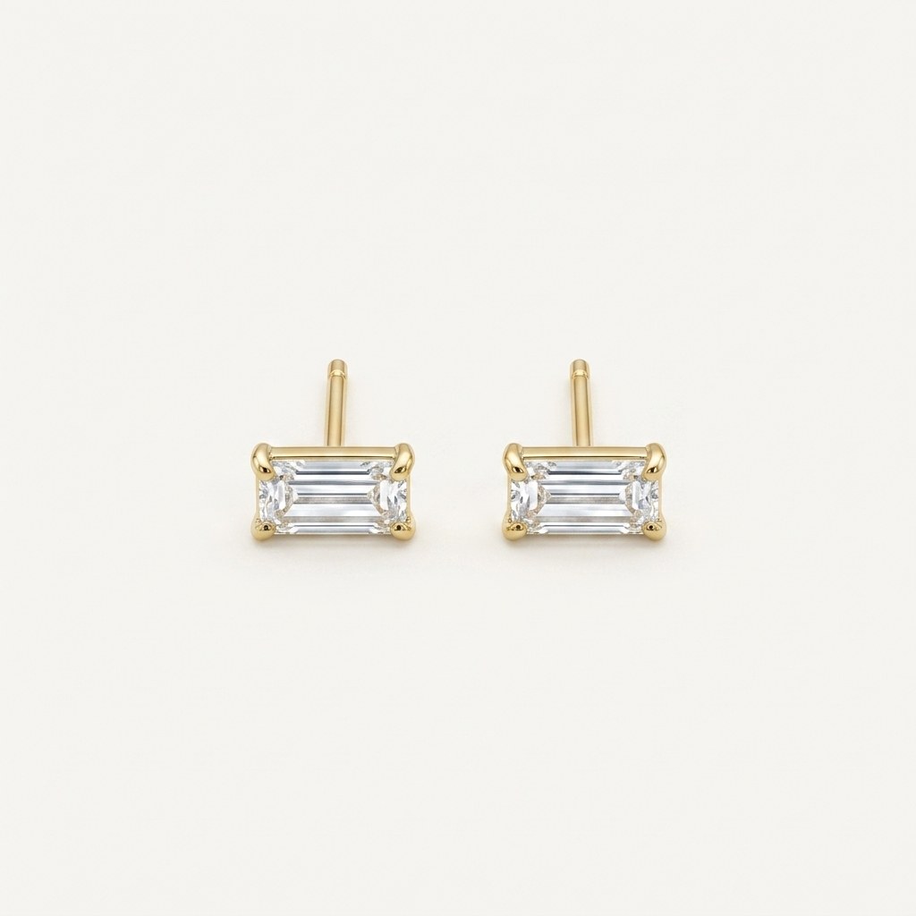 14K solid gold clear baguette stud earrings on a warm ivory background