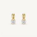 14K solid gold teardrop solitaire drop stud earrings on a warm ivory background
