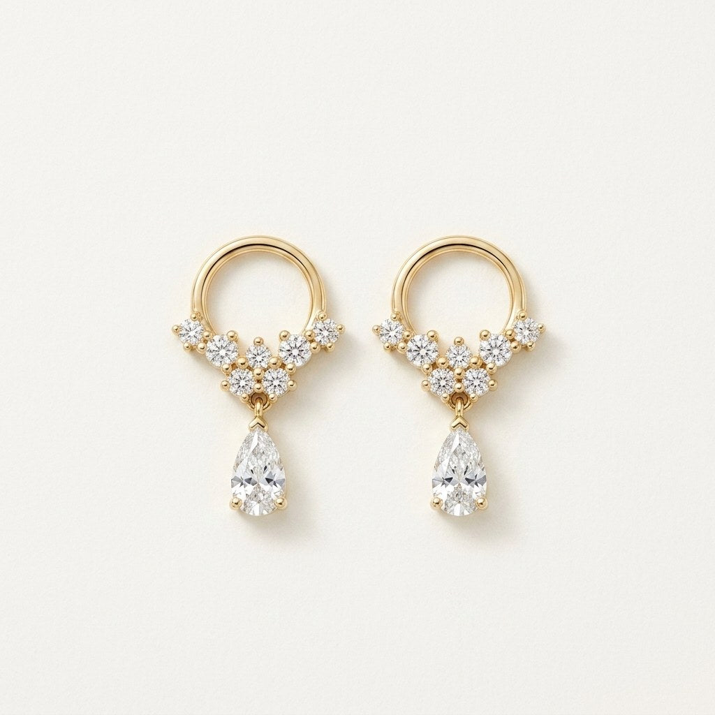 14K solid gold floral teardrop drop stud earrings on a warm ivory background