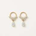 14K solid gold floral teardrop drop stud earrings on a warm ivory background