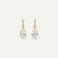 14K solid gold stone-set stud earrings on a warm ivory background