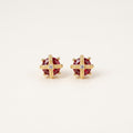 14K solid gold ruby cross stud earrings on a warm ivory background