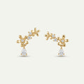 14K solid gold flower branch drop stud earrings on a warm ivory background