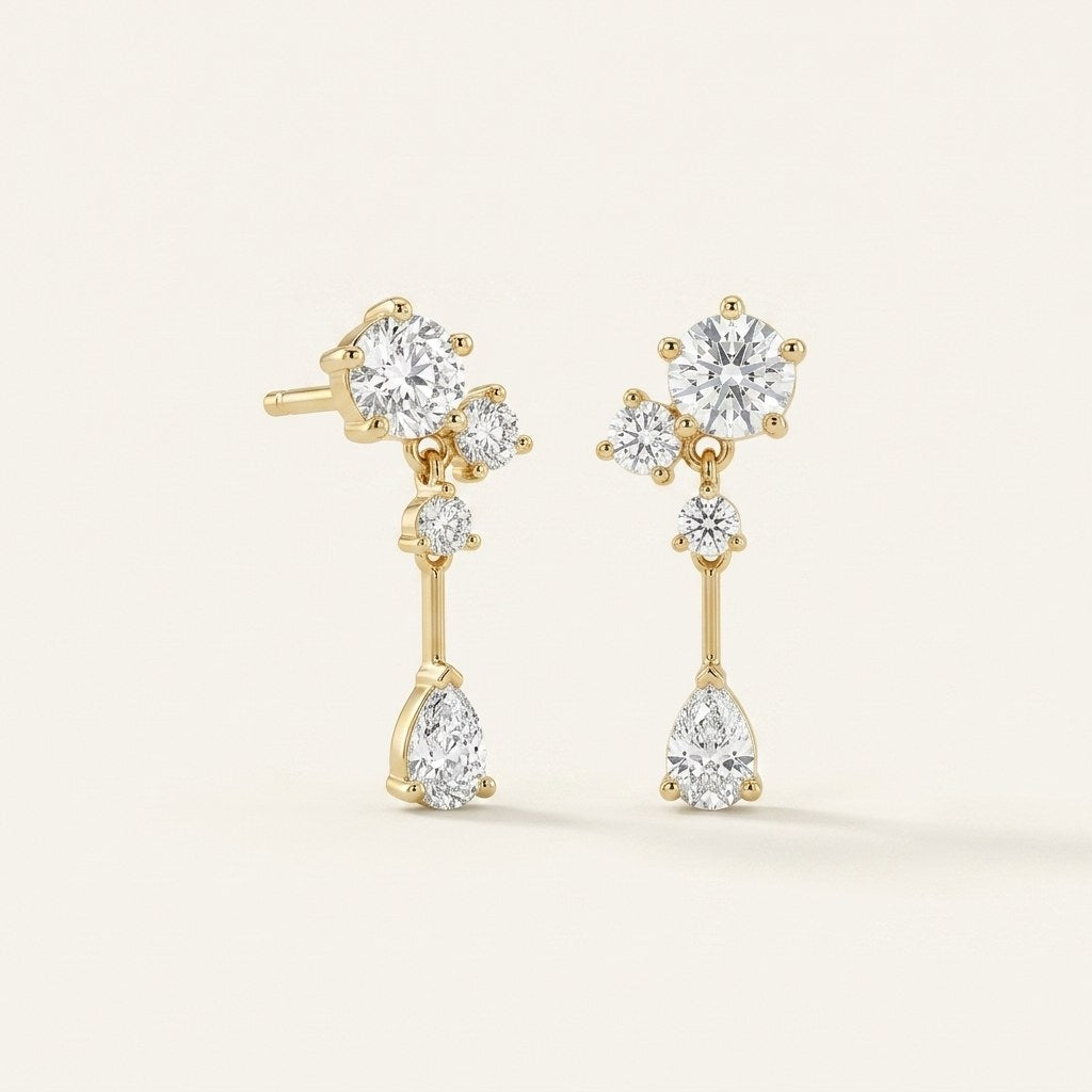 14K solid gold teardrop bar drop stud earrings on a warm ivory background