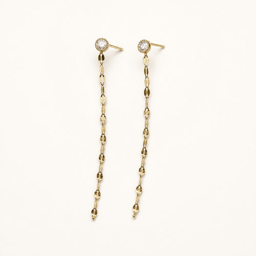 14K solid gold bezel stone chain drop earrings on a warm ivory background