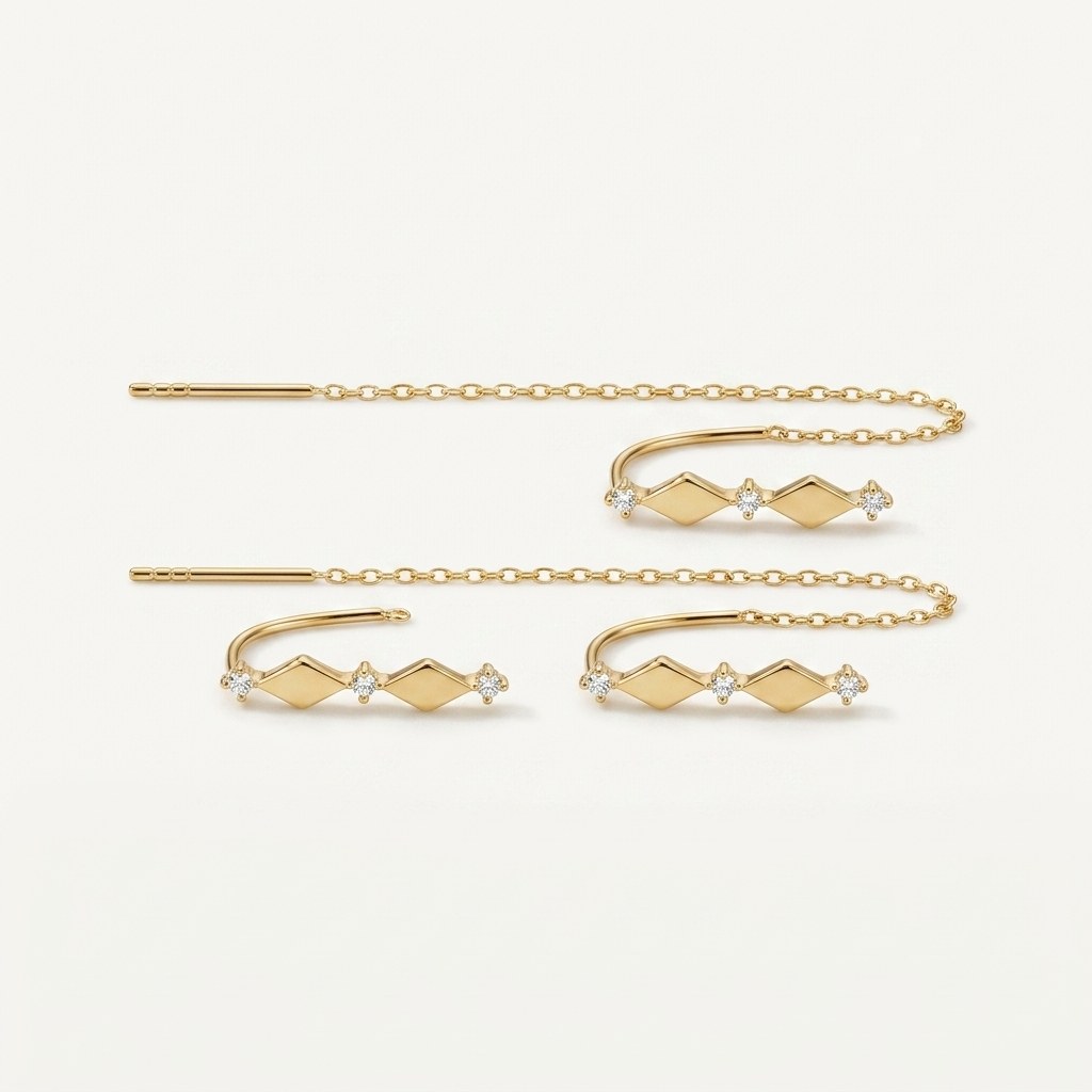 14K solid gold geometric bar chain drop earrings on a warm ivory background
