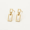 14K solid gold geometric rectangle drop stud earrings on a warm ivory background