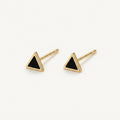 14K solid gold black triangle stud earrings on a warm ivory background