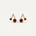 14K solid gold ruby cherry stud earrings on a warm ivory background