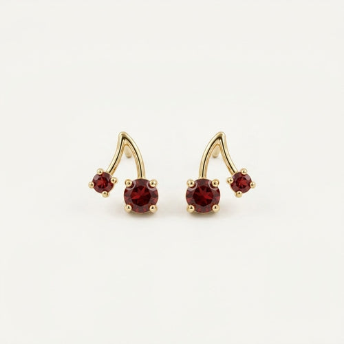 14K solid gold ruby cherry stud earrings on a warm ivory background