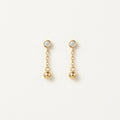 14K solid gold bezel ball chain drop earrings on a warm ivory background