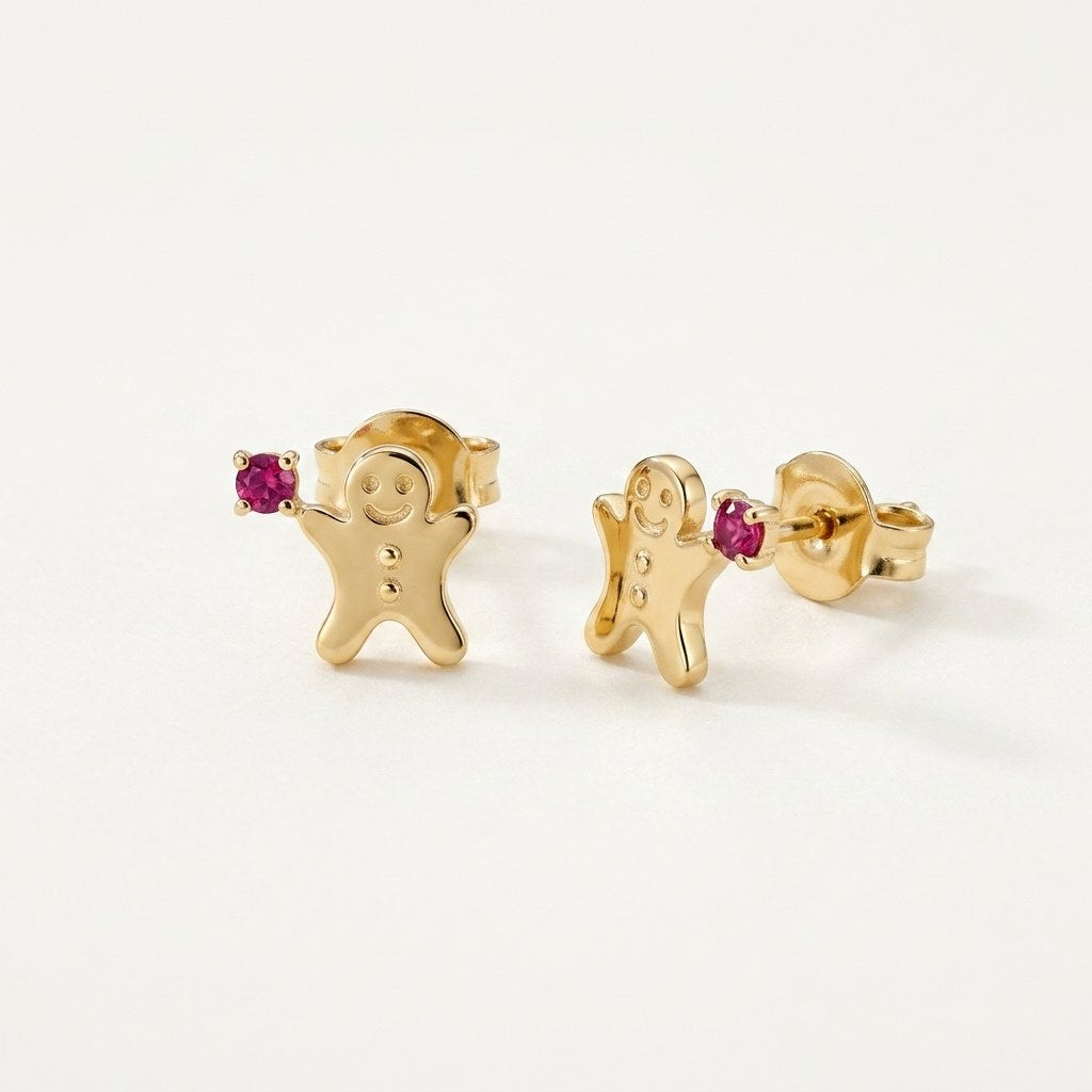 14K solid gold ruby gingerbread stud earrings on a warm ivory background