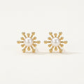 14K solid gold pearl sunburst stud earrings on a warm ivory background