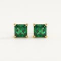 14K solid gold green princess cut stud earrings on a warm ivory background