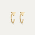 14K solid gold stud earrings on a warm ivory background