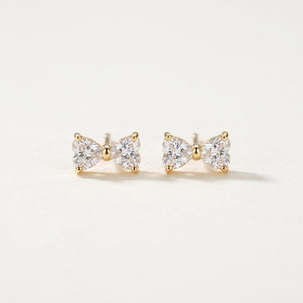 14K solid gold stone-set stud earrings on a warm ivory background