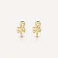 14K solid gold stud earrings on a warm ivory background