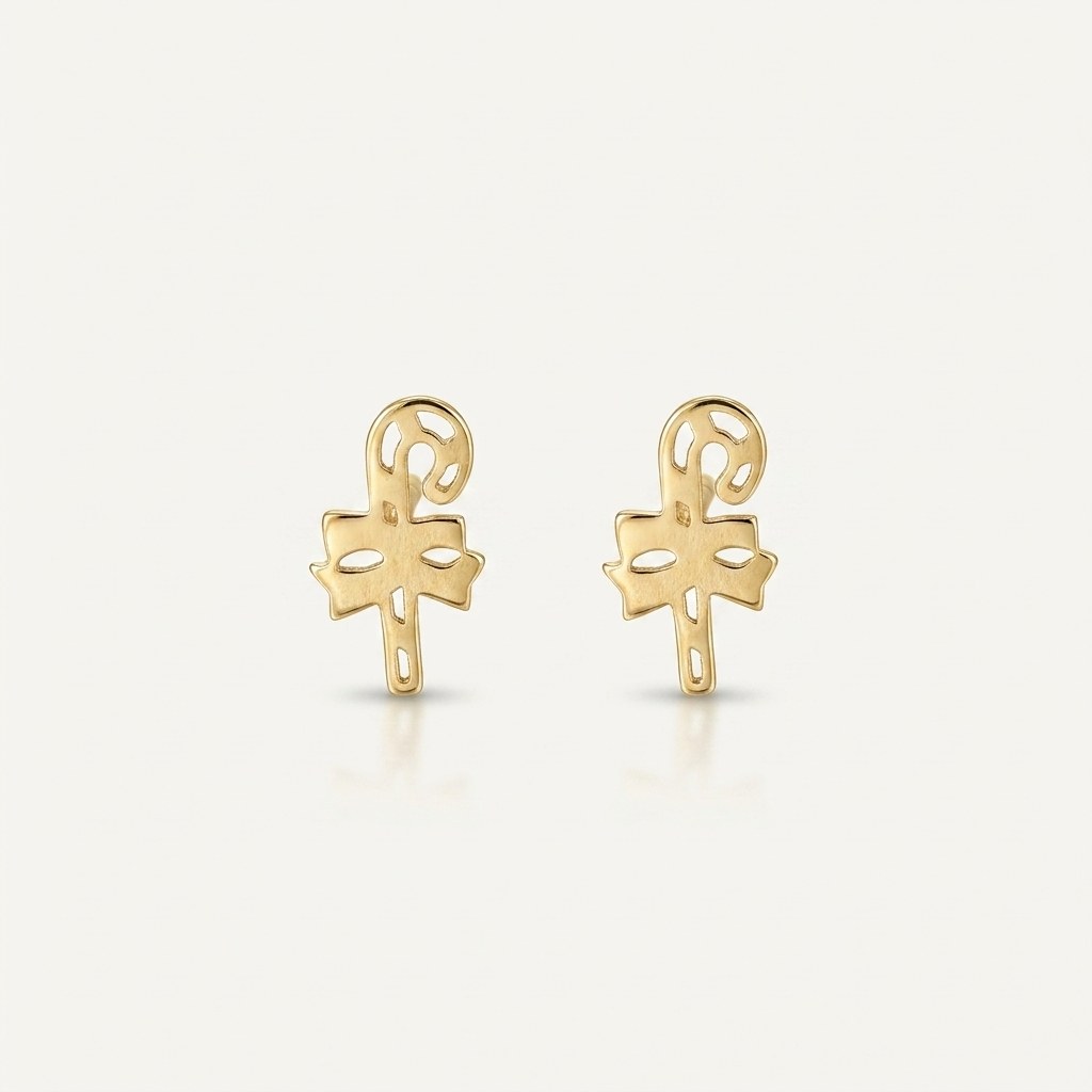 14K solid gold stud earrings on a warm ivory background