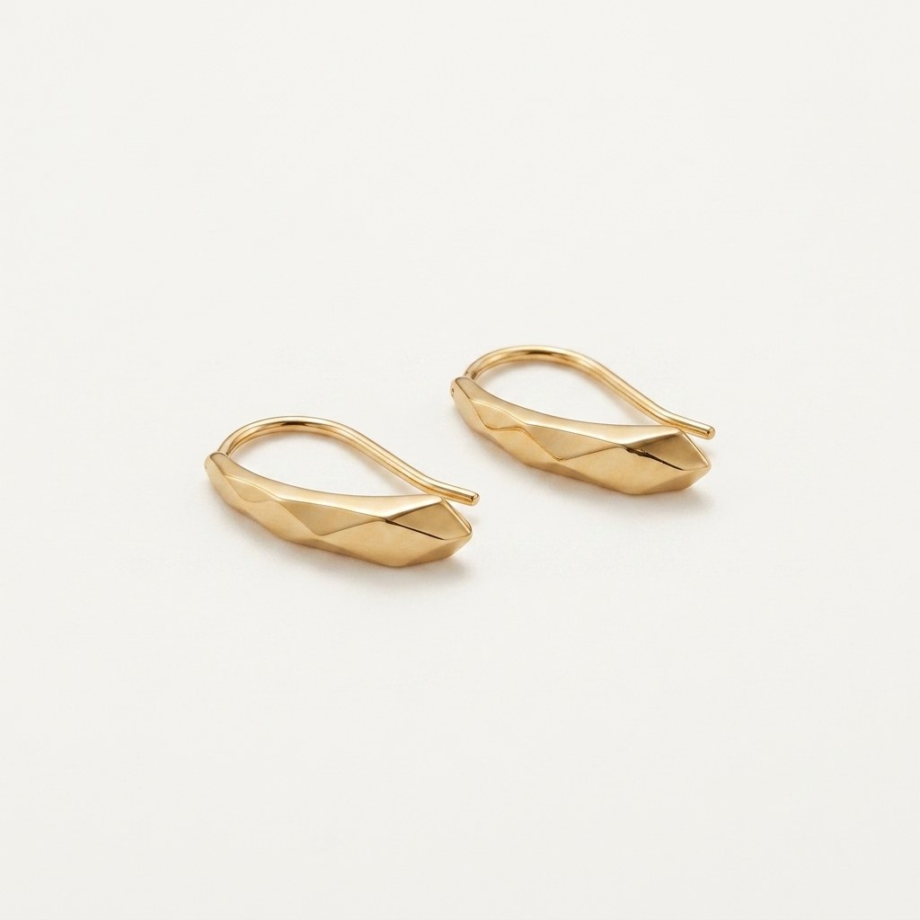 14K solid gold faceted threader stud earrings on a warm ivory background