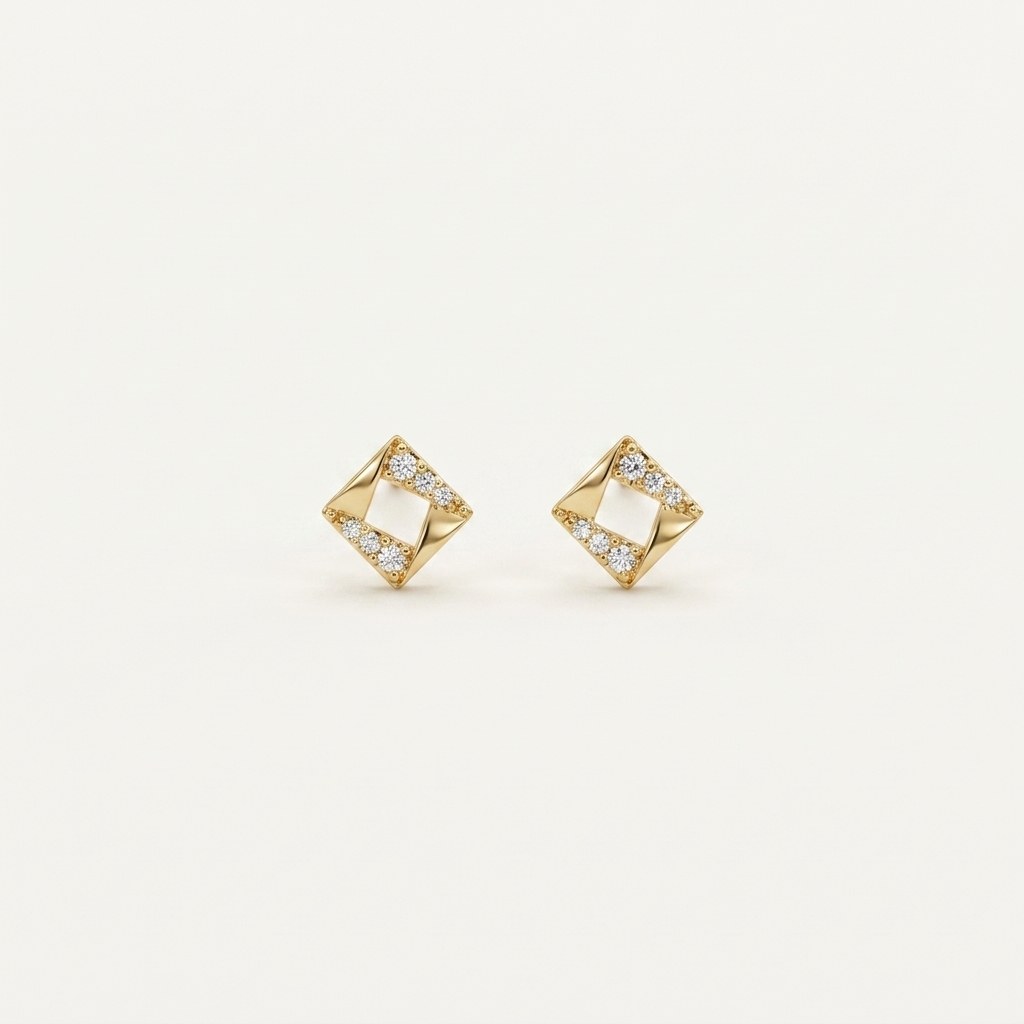 14K solid gold stud earrings on a warm ivory background