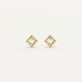 14K solid gold stud earrings on a warm ivory background