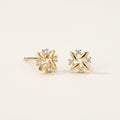 14K solid gold crystal pinwheel flower stud earrings on a warm ivory background