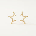 14K solid gold stud earrings on a warm ivory background