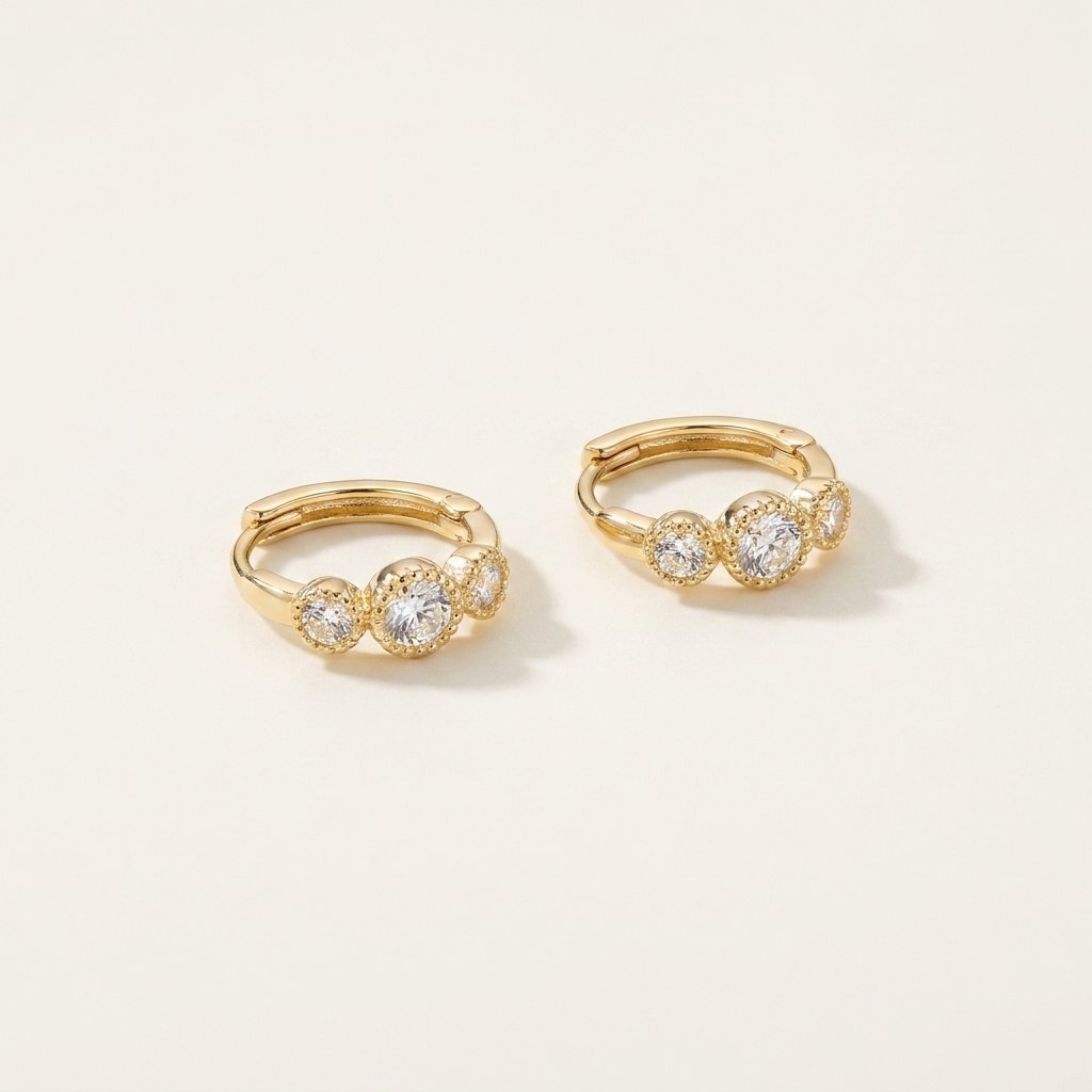 Solid Gold Hoop Earrings - 7.3mm Inner Diameter - Style 620 in yellow gold on a warm ivory background