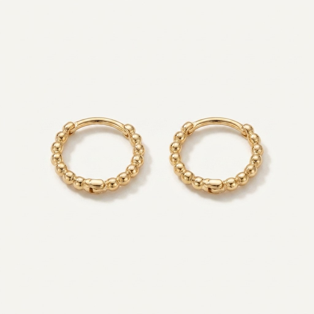 Solid Gold Hoop Earrings - 8mm Inner Diameter - Style 624 in yellow gold on a warm ivory background