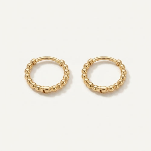 Solid Gold Hoop Earrings - 8mm Inner Diameter - Style 624 in yellow gold on a warm ivory background