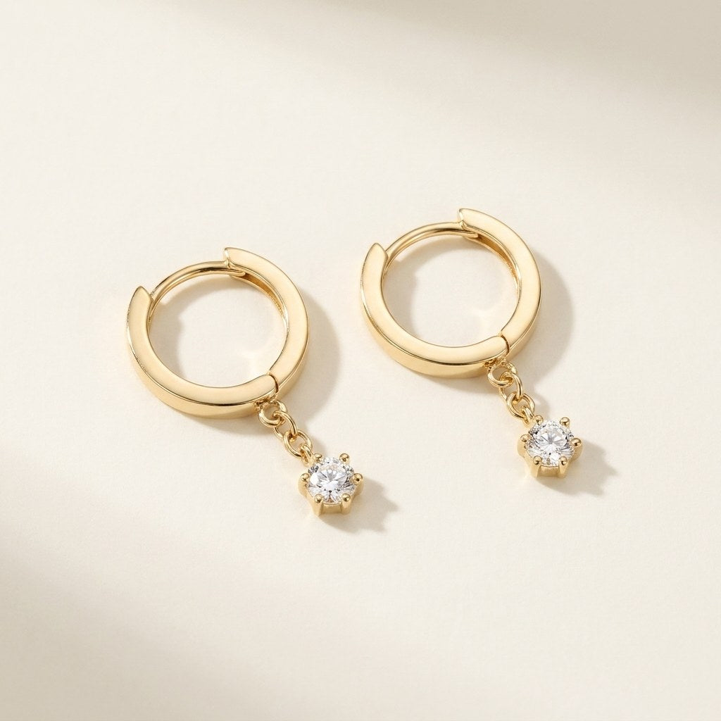 Solid Gold Hoop Earrings - 8.7mm Inner Diameter - Style 632 in yellow gold on a warm ivory background
