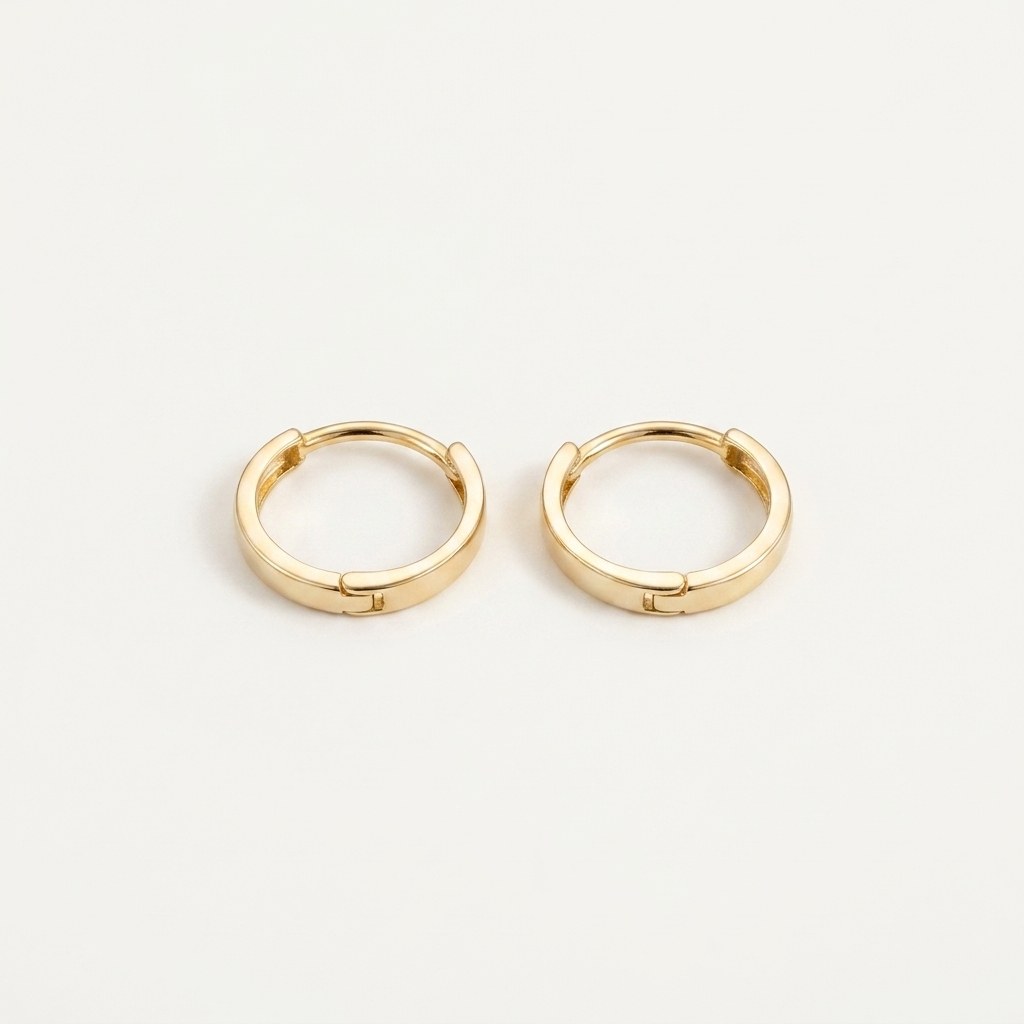 Solid Gold Hoop Earrings - 8.5mm Inner Diameter - Style 634 in yellow gold on a warm ivory background