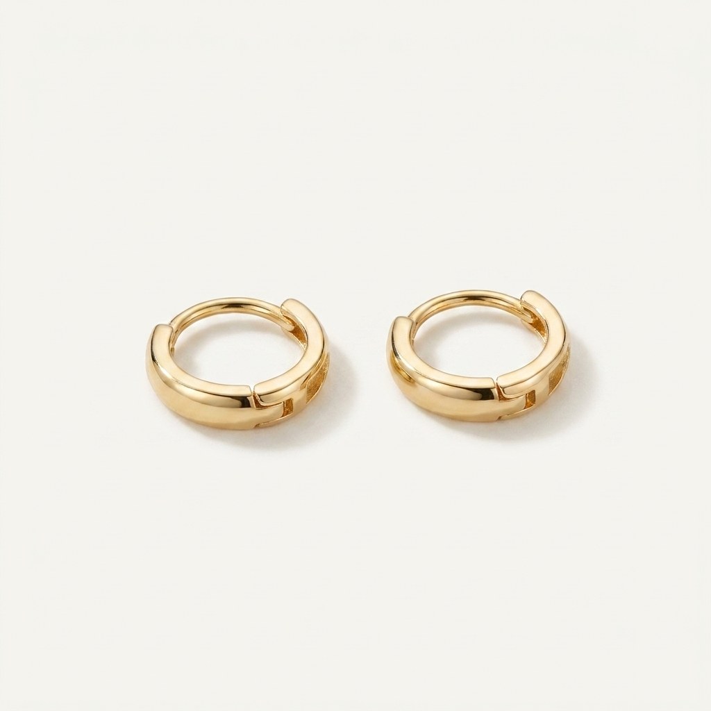 Solid Gold Hoop Earrings - 6mm / 7mm / 8mm / 9mm Inner Diameter - Style 646 in yellow gold on a warm ivory background