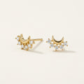 14K solid gold crescent crystal cluster stud earrings on a warm ivory background