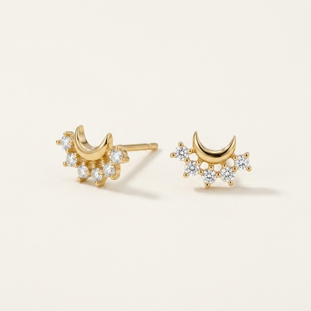 14K solid gold crescent crystal cluster stud earrings on a warm ivory background