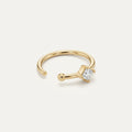 Solid Gold Square Gemstone Nose Hoop in yellow gold on a warm ivory background