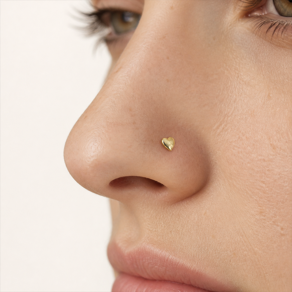 Solid Gold Heart Nose Stud worn on the nose