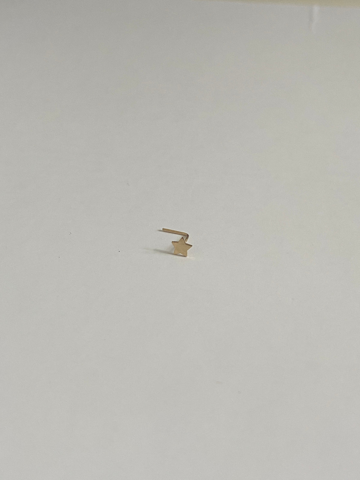 Actual product photo of Solid Gold Star Nose Stud