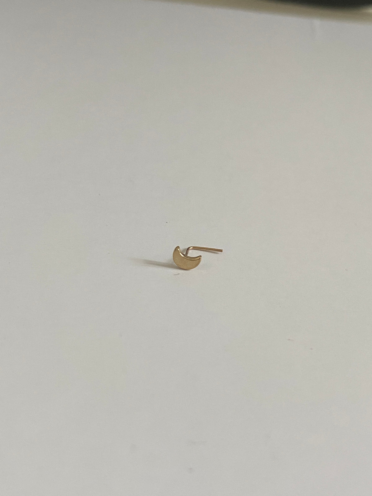 Actual product photo of Solid Gold Crescent Moon Nose Stud