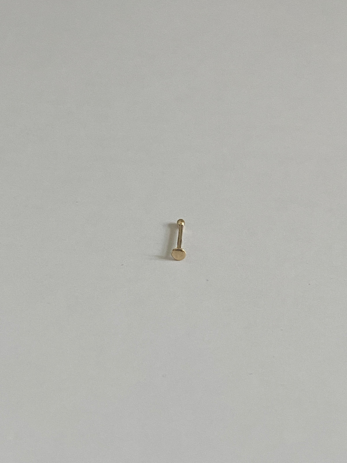 Actual product photo of Solid Gold Flat Disc Nose Stud